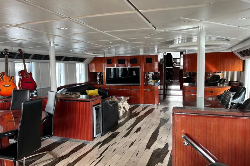 Slide: The Image of Luxurious interior of a 1996 Monte Fino 92 yacht with elegant wood finishes and modern amenities. - 92
