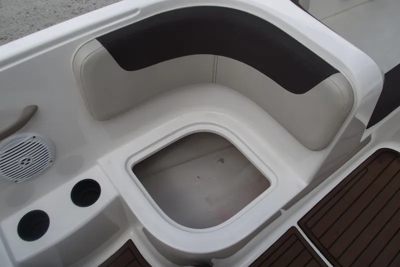 Slide: The Image of 2021 Bayliner Element E18 boat interior with seating and storage compartment. - 16