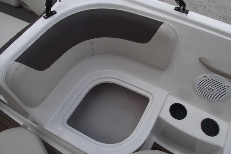 Slide: The Image of Interior seating and storage area of a 2021 Bayliner Element E18 boat. - 17