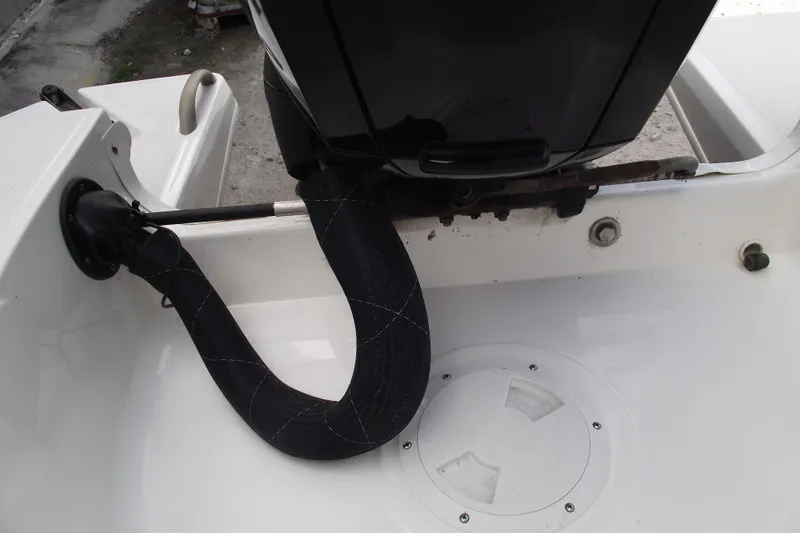 Slide: The Image of 2021 Bayliner Element E18 boat engine compartment with protective hose cover. - 24