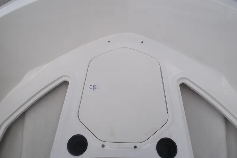 Slide: The Image of 2021 Bayliner Element E18 boat deck with storage compartment and cup holders. - 9