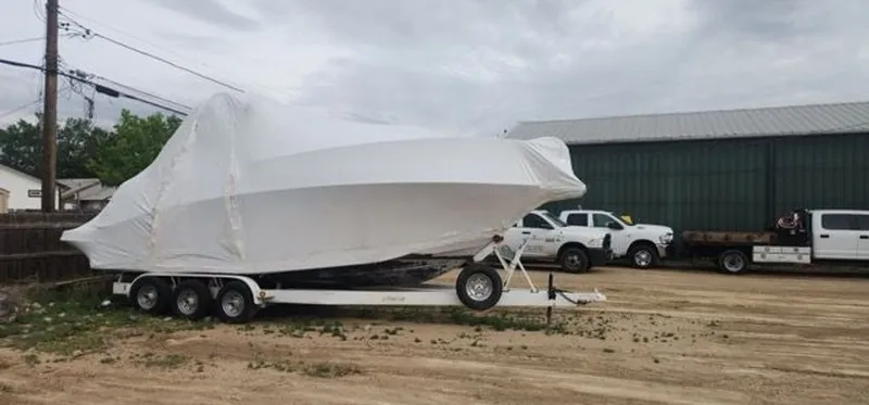 Slide: The Image of 2005 Four Winns 288 Vista boat covered on trailer. - 12