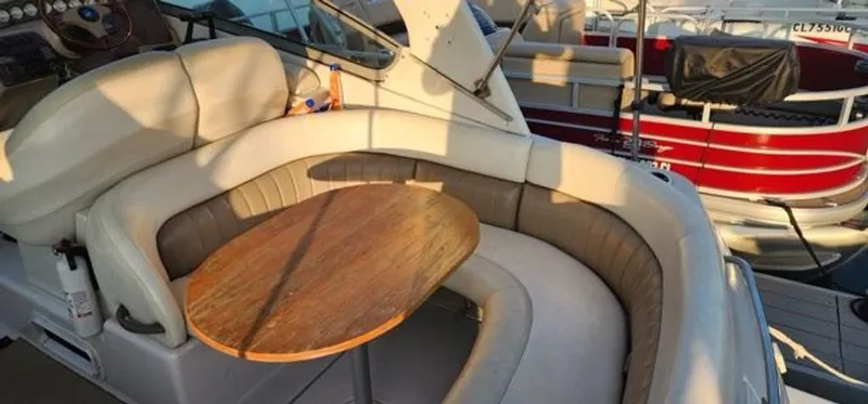 Slide: The Image of Interior of a 2005 Four Winns 288 Vista yacht with seating area. - 5