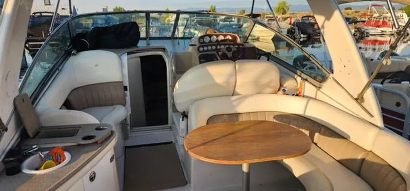 Slide: The Image of Interior of a 2005 Four Winns 288 Vista yacht with seating area. - 6