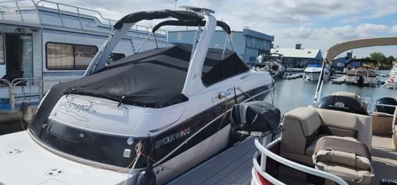 Slide: The Image of 2005 Four Winns 288 Vista boat docked at marina. - 8