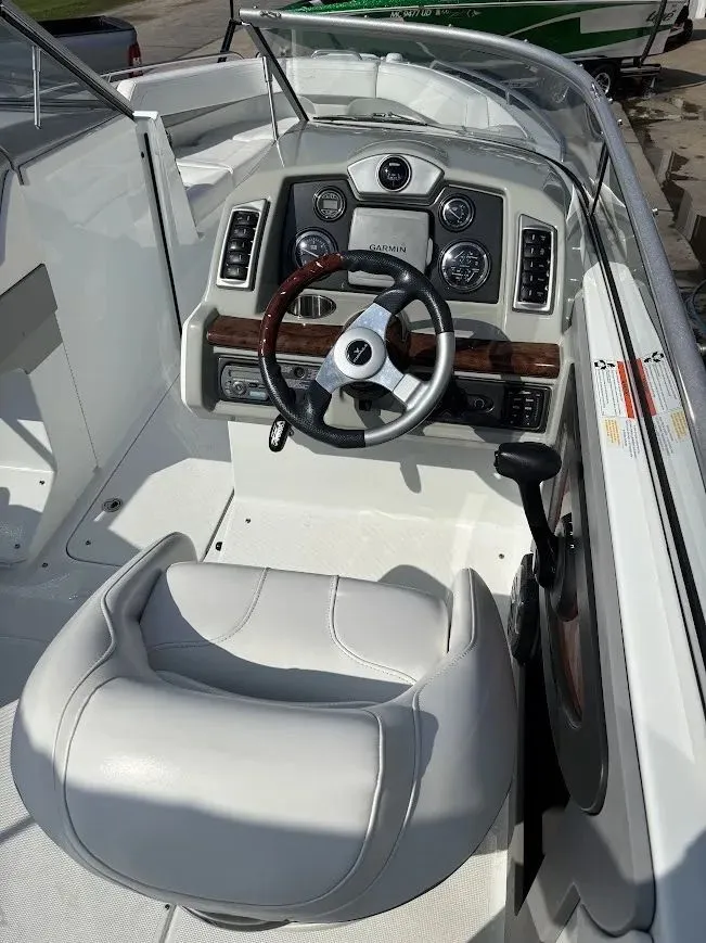 Slide: The Image of Interior view of a 2010 Formula 270 Bowrider boat with steering console. - 10