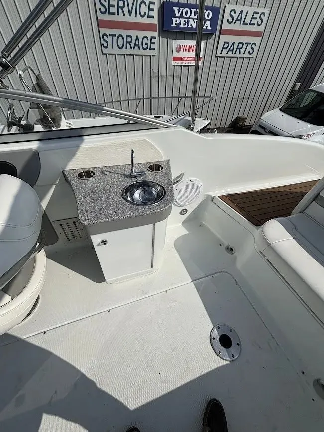 Slide: The Image of Interior of a 2010 Formula 270 Bowrider with sink and seating area. - 11