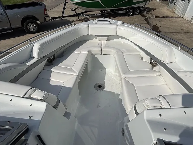 Slide: The Image of Interior view of a 2010 Formula 270 Bowrider boat with white seating. - 20