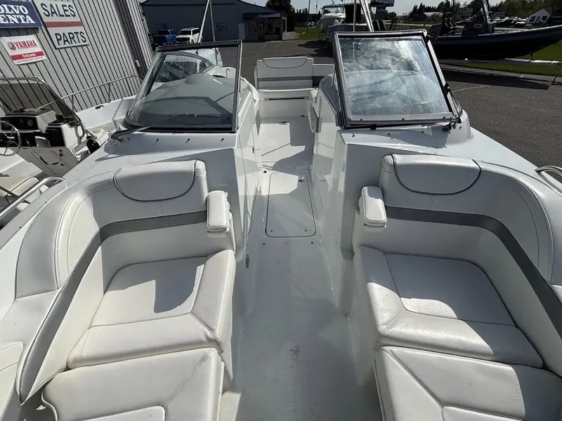 Slide: The Image of Interior view of a 2010 Formula 270 Bowrider boat with white seating. - 21