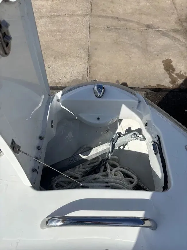 Slide: The Image of Anchor compartment of a 2010 Formula 270 Bowrider boat. - 22