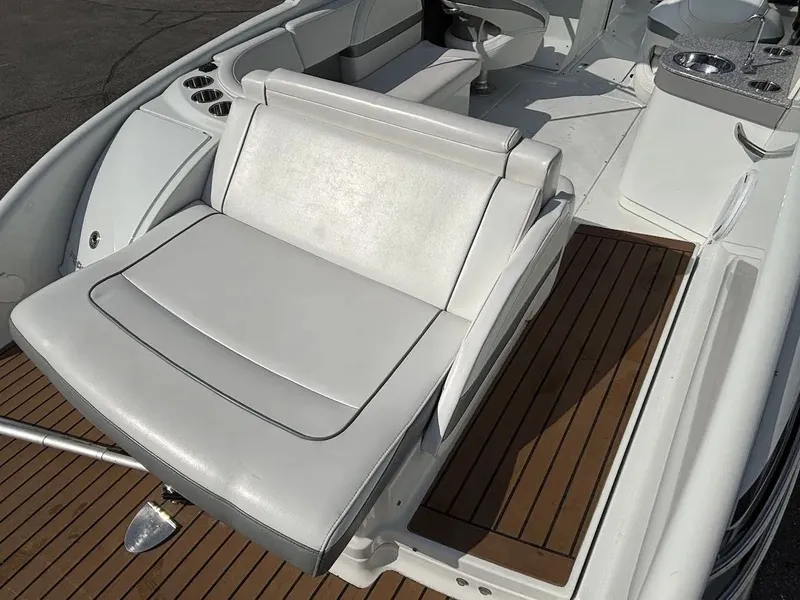 Slide: The Image of Interior of a 2010 Formula 270 Bowrider with white seats and wood flooring. - 6