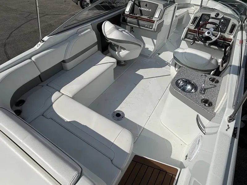 Slide: The Image of Interior of a 2010 Formula 270 Bowrider boat with seating and helm console. - 7
