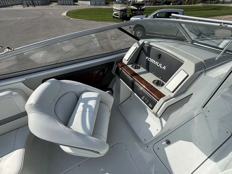 Slide: The Image of Interior of a 2010 Formula 270 Bowrider boat with helm console. - 9