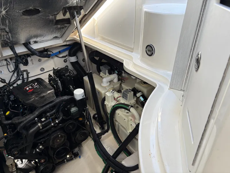 Slide: The Image of Engine compartment of 2006 Sea Ray Sundancer 320 with motor and wiring. - 21