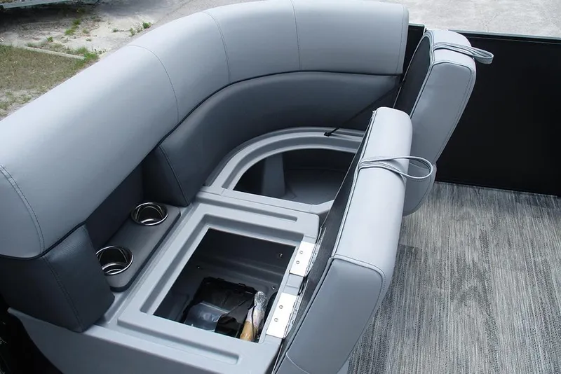 Slide: The Image of 2026 Bentley Pontoons Bolt 203 interior seating with storage and cup holders. - 10