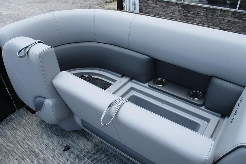 Slide: The Image of 2026 Bentley Pontoons Bolt 203 interior seating with cup holders and sleek design. - 14