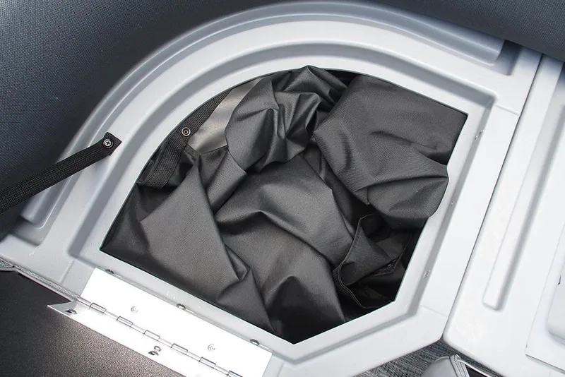 Slide: The Image of Storage compartment of 2026 Bentley Pontoons Bolt 203 with black fabric inside. - 15