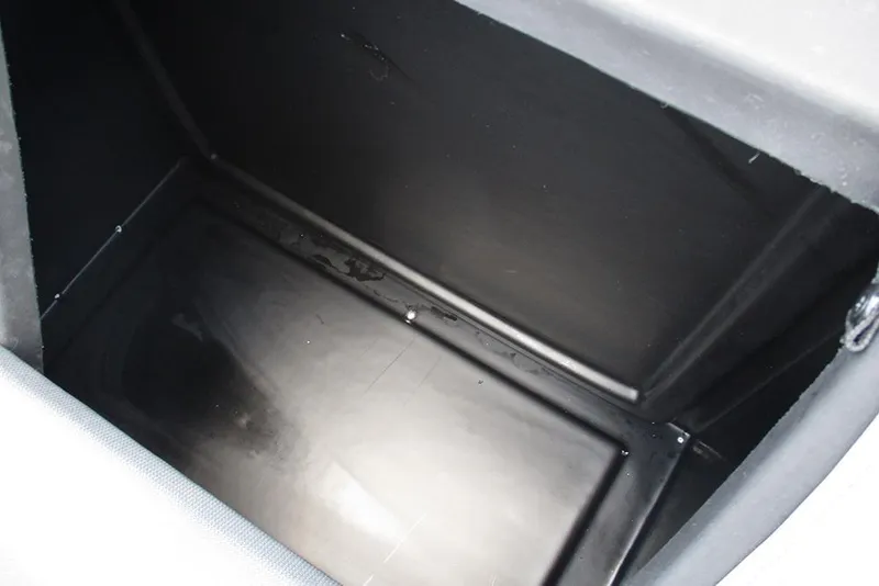 Slide: The Image of Storage compartment of 2026 Bentley Pontoons Bolt 203, featuring a sleek black interior. - 21