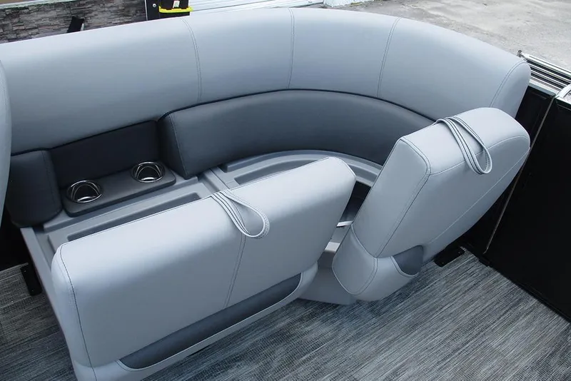 Slide: The Image of 2026 Bentley Pontoons Bolt 203 interior seating with cup holders, featuring sleek gray upholstery. - 23