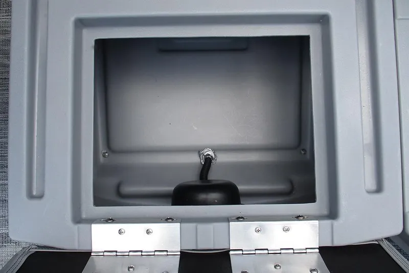 Slide: The Image of 2026 Bentley Pontoons Bolt 203 storage compartment with open lid and visible wiring. - 24