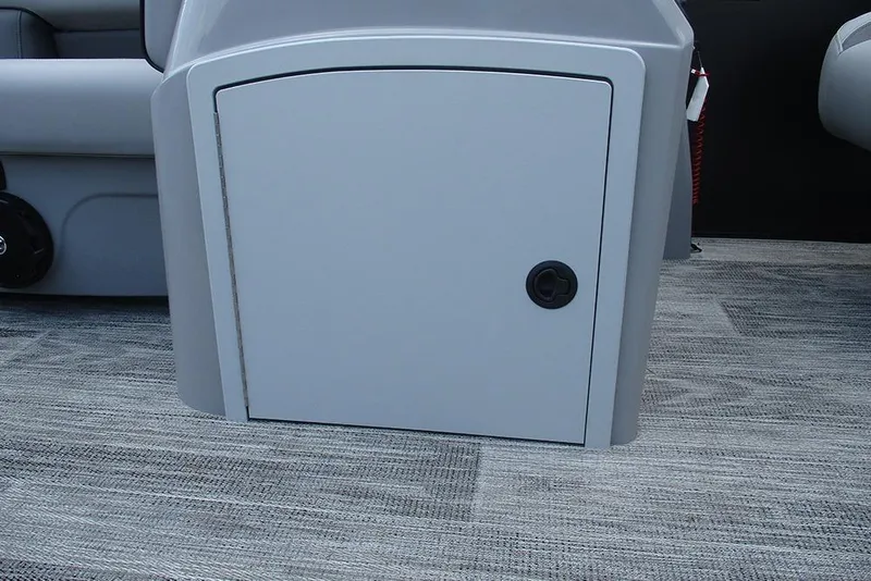 Slide: The Image of 2026 Bentley Pontoons Bolt 203 interior storage compartment on carpeted floor. - 26