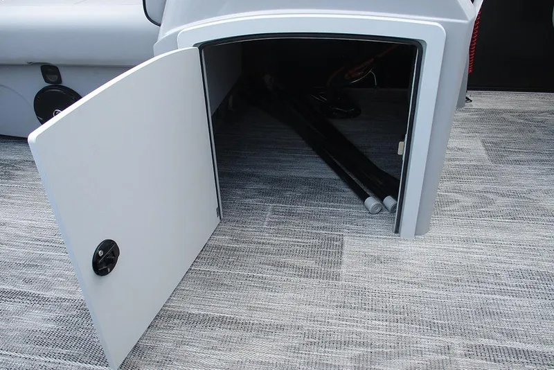 Slide: The Image of Open storage compartment on 2026 Bentley Pontoons Bolt 203 with visible interior items. - 27