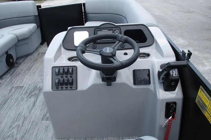 Slide: The Image of 2026 Bentley Pontoons Bolt 203 helm with steering wheel and control panel. - 29
