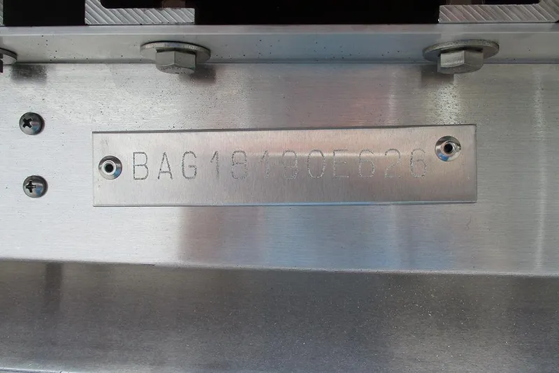 Slide: The Image of Close-up of Bentley Pontoons Bolt 203 serial number plate, year 2026. - 30