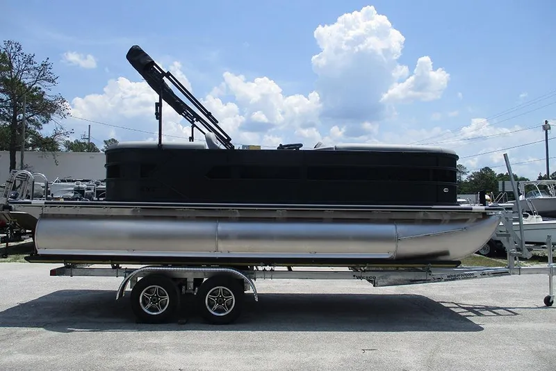 Slide: The Image of 2026 Bentley Pontoons Bolt 203 on trailer under a clear blue sky. - 6