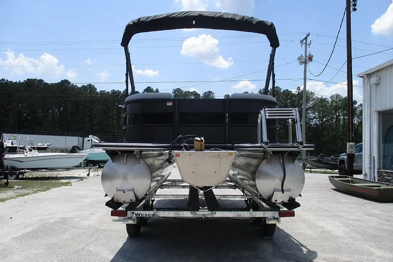 Slide: The Image of 2026 Bentley Pontoons Bolt 203 on trailer, outdoor setting, clear sky background. - 8