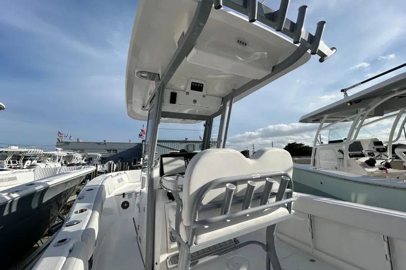 Slide: The Image of 2026 Sea Fox 268 Commander boat with sleek design and modern features under a clear sky. - 3