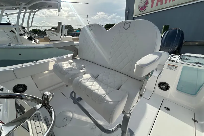 Slide: The Image of 2026 Sea Fox 268 Commander boat interior with plush seating and steering wheel. - 11