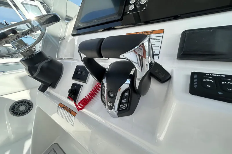 Slide: The Image of 2026 Sea Fox 268 Commander helm with controls and steering wheel. - 8