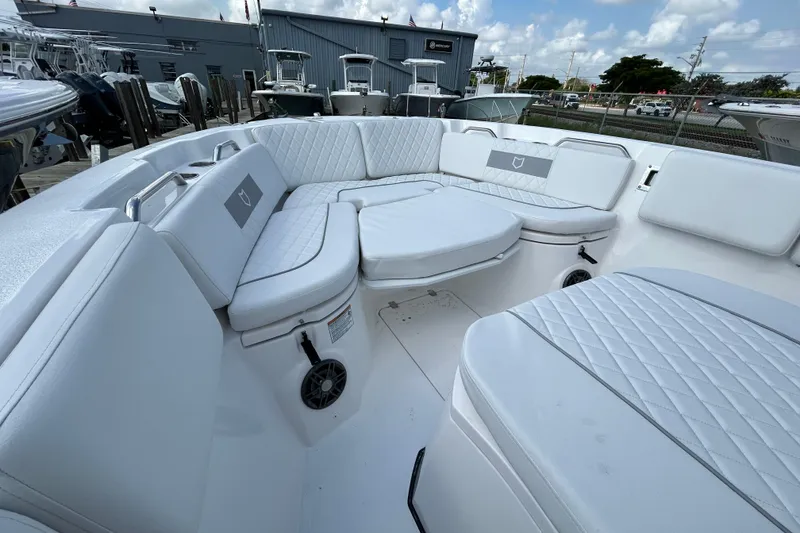 Slide: The Image of Luxurious seating area on 2026 Sea Fox 268 Commander boat, featuring white quilted upholstery. - 17