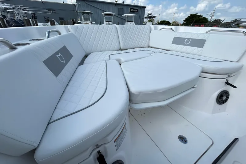 Slide: The Image of Luxurious seating on 2026 Sea Fox 268 Commander boat, featuring quilted white upholstery. - 18