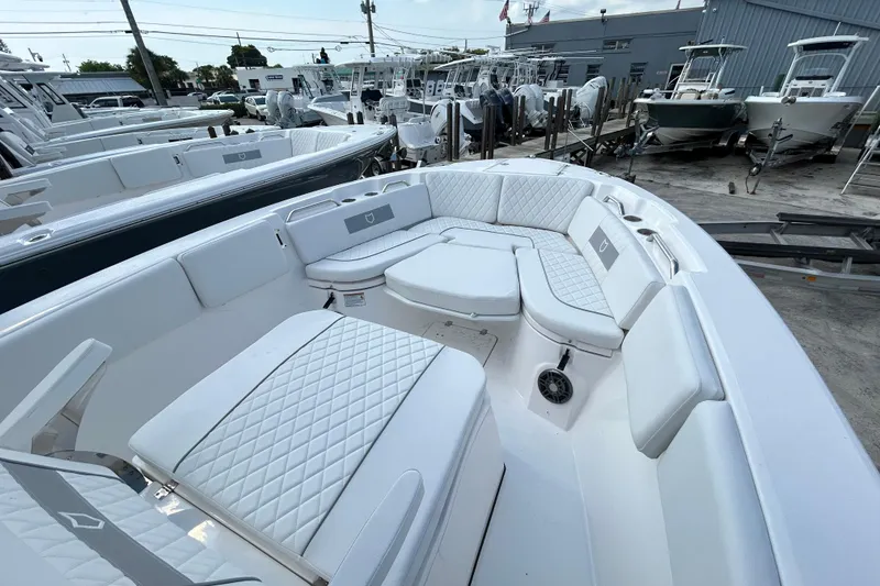 Slide: The Image of 2026 Sea Fox 268 Commander boat interior with white cushioned seating and modern design. - 22