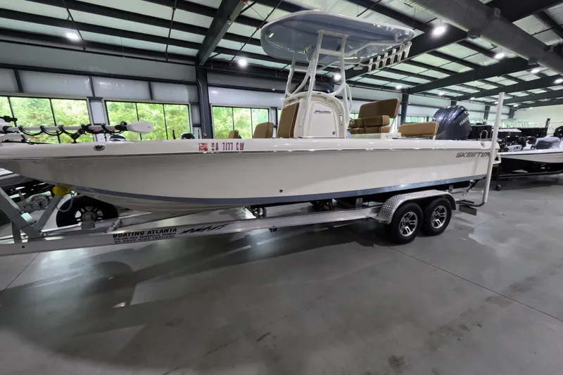 The Image of 2024 Skeeter SX2550 Family boat on trailer in indoor showroom. - 1