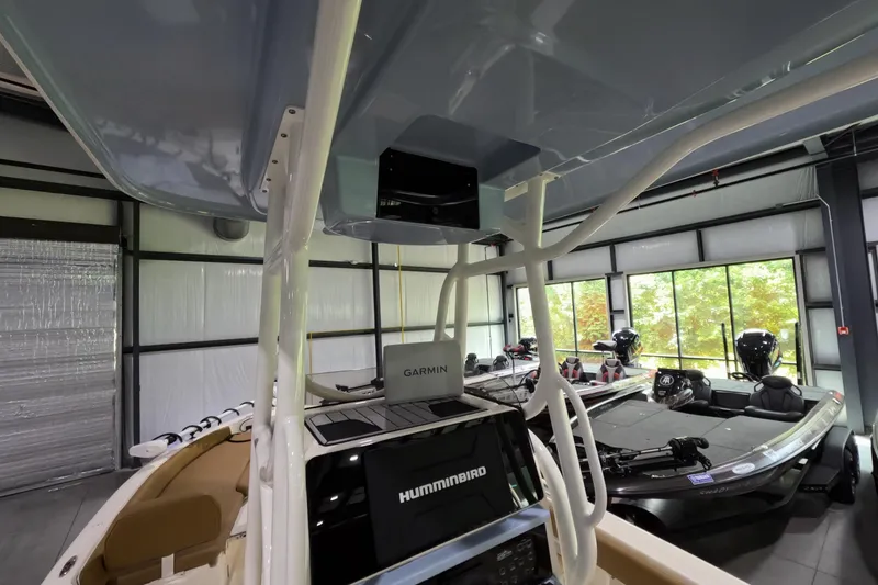 Slide: The Image of 2024 Skeeter SX2550 Family boat interior with Garmin and Humminbird electronics. - 13