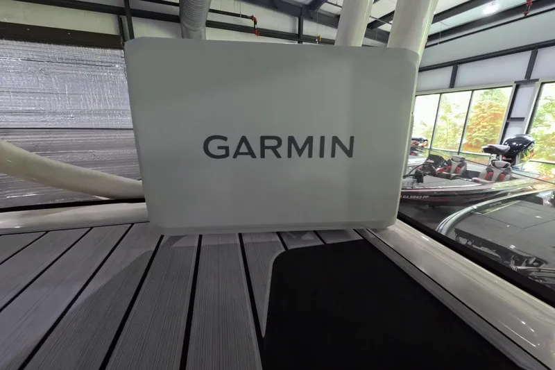 Slide: The Image of 2024 Skeeter SX2550 Family boat with Garmin equipment in a showroom. - 14