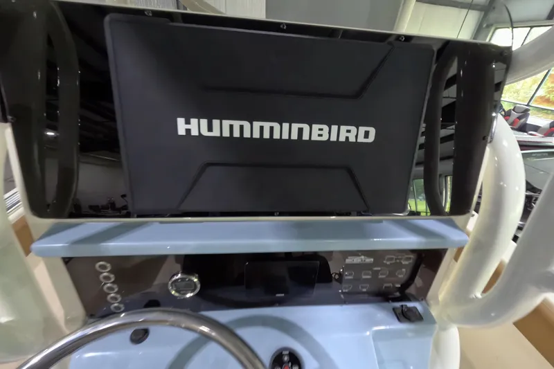 Slide: The Image of 2024 Skeeter SX2550 Family boat dashboard with Humminbird electronics display. - 15
