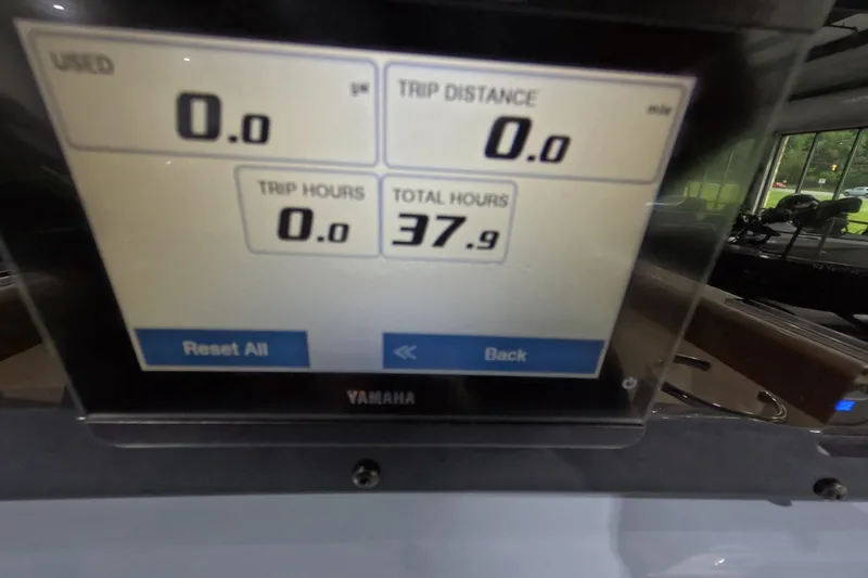 Slide: The Image of 2024 Skeeter SX2550 Family boat dashboard displaying trip and total hours. - 16