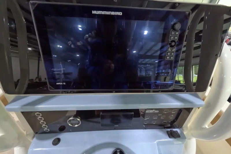 Slide: The Image of 2024 Skeeter SX2550 Family boat dashboard with Humminbird Apex 16 display. - 17
