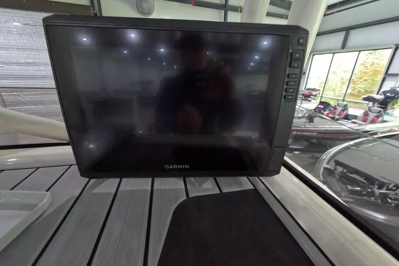 Slide: The Image of Garmin display on 2024 Skeeter SX2550 Family boat, indoor showroom setting. - 18