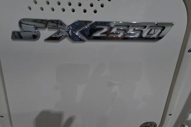 Slide: The Image of 2024 Skeeter SX2550 Family boat emblem on white surface. - 19