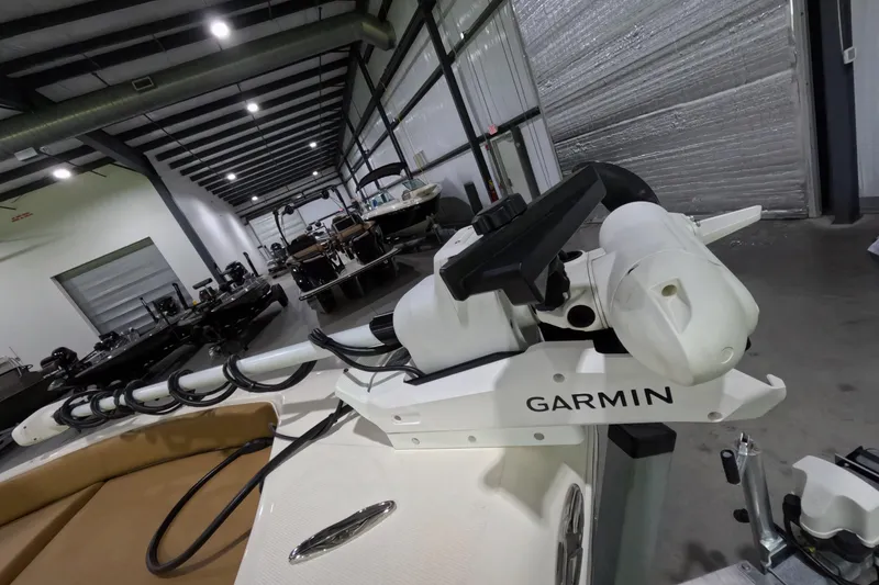 Slide: The Image of 2024 Skeeter SX2550 Family boat with Garmin equipment in a showroom. - 21