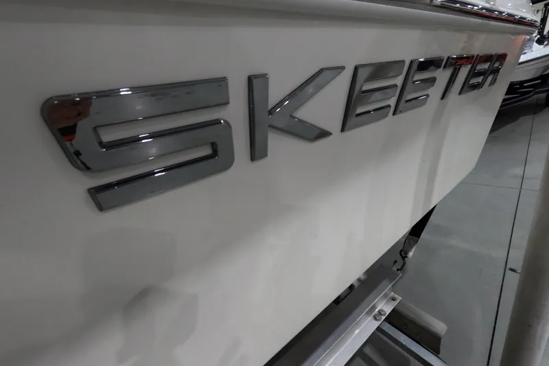 Slide: The Image of 2024 Skeeter SX2550 Family boat logo on white hull. - 23