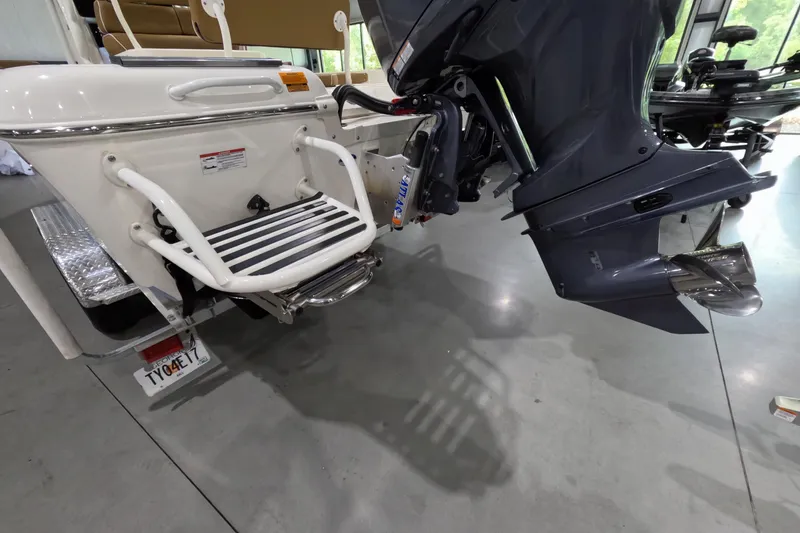 Slide: The Image of 2024 Skeeter SX2550 Family boat with motor and swim platform in showroom. - 3