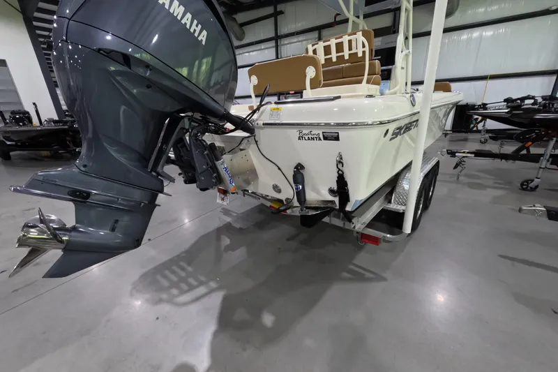 Slide: The Image of 2024 Skeeter SX2550 Family boat with Yamaha outboard motor in showroom. - 4