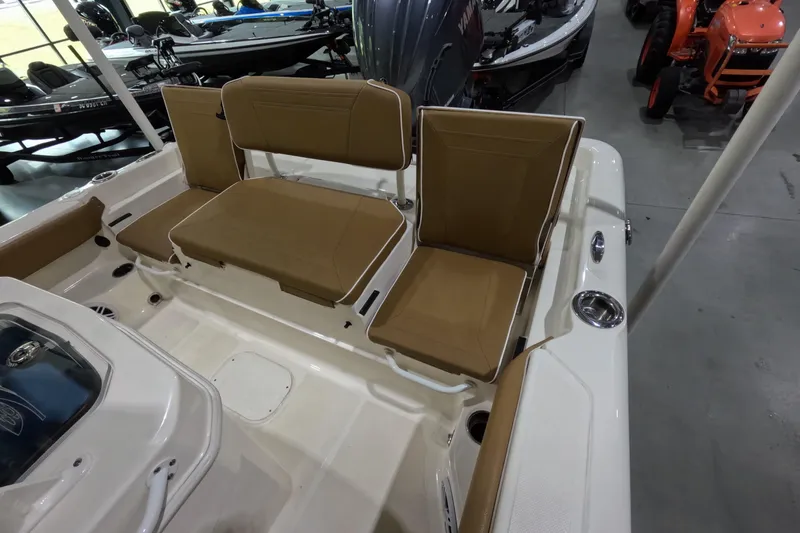 Slide: The Image of 2024 Skeeter SX2550 Family boat interior with tan seating and white deck. - 9