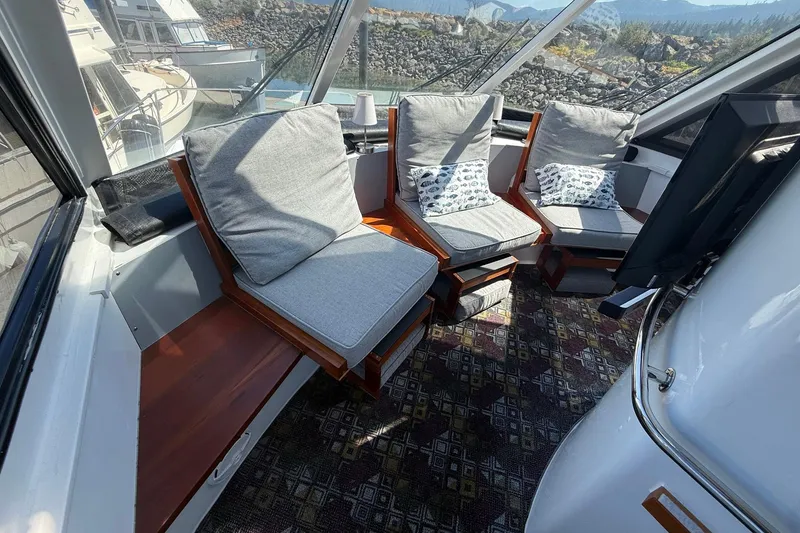 Slide: The Image of Luxurious 2004 TLD Custom Power Cat interior with cushioned seating and scenic views. - 17